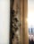 This large, circa 1900, mirror features ornate corners with an acanthus motif. The finish is a very muted gold tone....