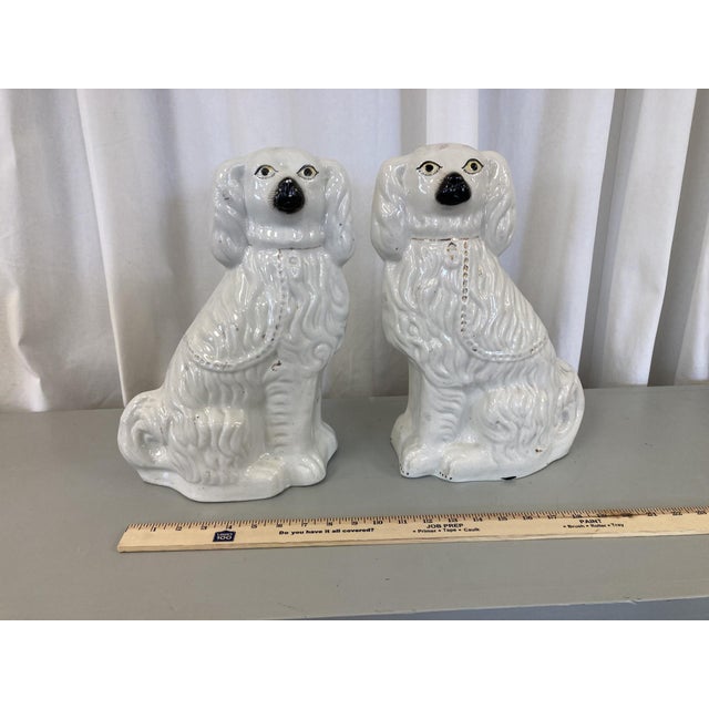This pair of Staffordshire Terriers appear to be original. They were loved so much that most of the painted details have...