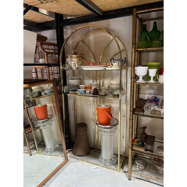 Up for consideration is a beautiful vintage gold metal Art Deco style bookcase with glass shelves. This would look lovely...