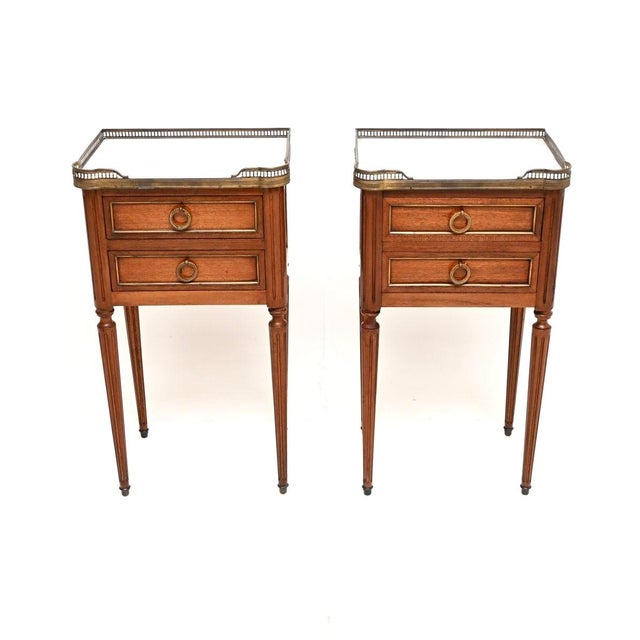 A beautiful pair of antique French marble top bedside / lamp tables, dating from around the 1890-1910 period. The quality...