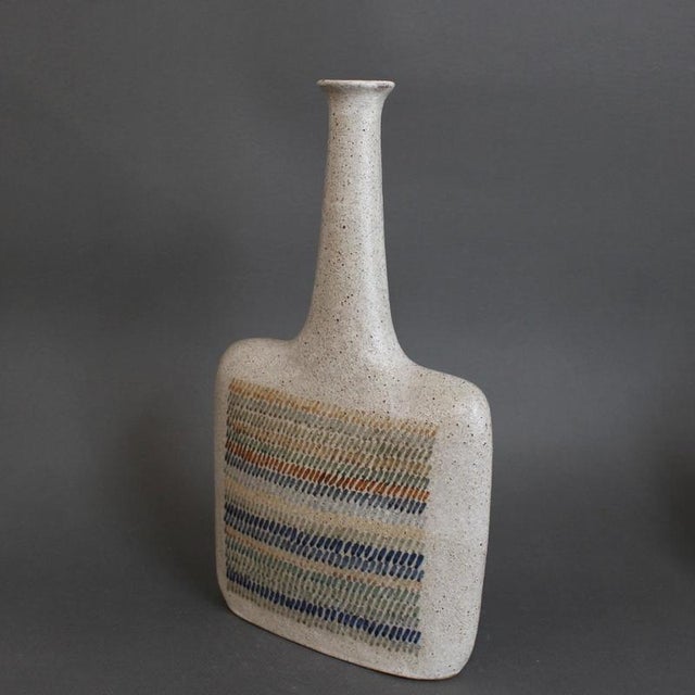 Italian ceramic decorative bottle / single-flower vase by bruno gambone (circa 1990s). This medium sculptural work...