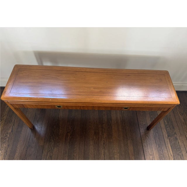 Vintage mid century campaign style console table. I believe its made by Drexel from their Passage collection. Sturdy and...