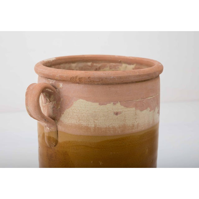 Rustic, handcrafted ceramic from Apulia, Italy. Originally used as a storage container, it also makes a decorative vase....