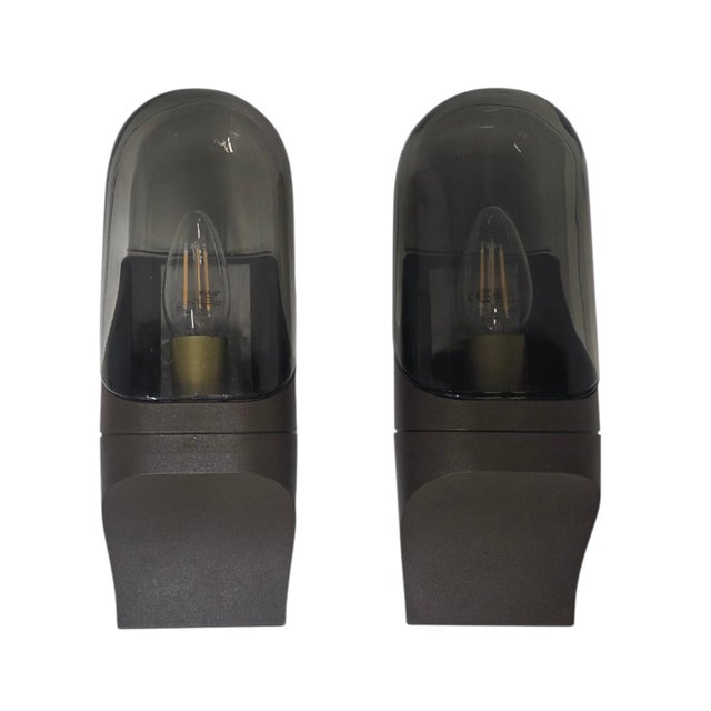 Made from high-quality plastic and elegant smoked glass, these wall lights impress with their sophisticated design and...
