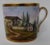 Antique 19th c. Paris porcelain coffee cup decorated with a continuous hand-painted landscape scene enhanced by rich...