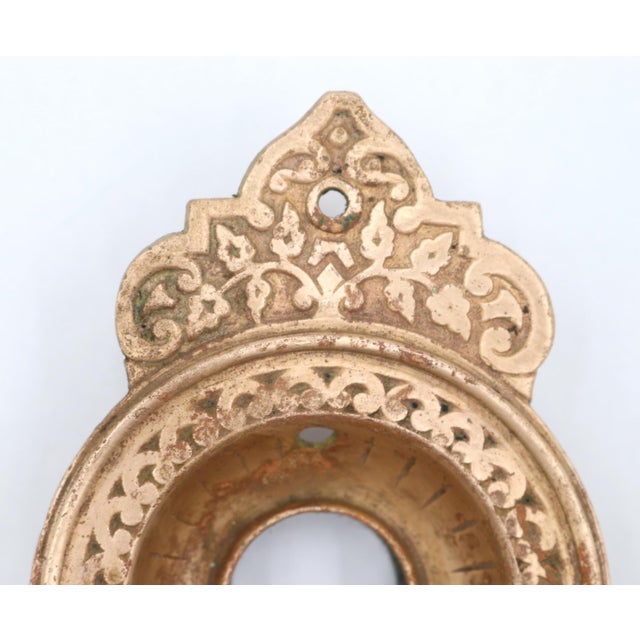 Victorian style cast bronze door bell plate with a polished finish. The original mounting screws are not available. Good...