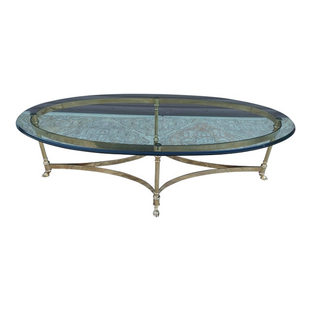 Vintage Hollywood Regency Brass Oval Coffee Table Glass Top and Hoof Detailed Feet. For Sale