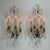 Elegant pair of Louis XVI-style gilt bronze and rock crystal wall sconces, featuring five candle-style lights arranged on...