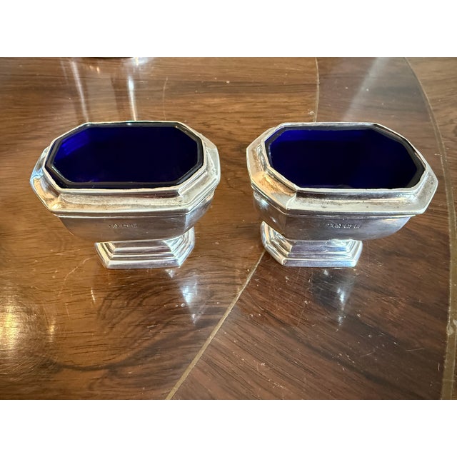 For your next dinner party, a handsome pair of large scale English sterling silver salts with cobalt glass liners. These...