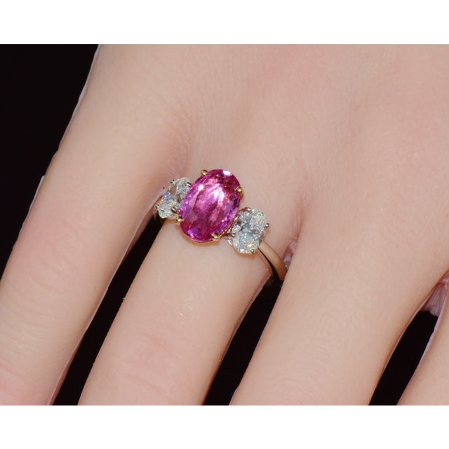 GIA certified 3.68CTS diamond and pink sapphire three-stone solid 950 platinum and 18K gold ring. This ring features a...