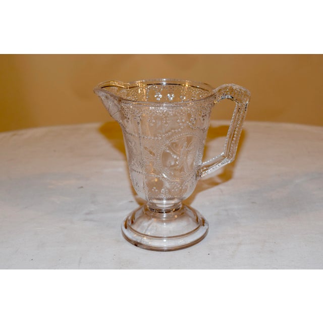 Interesting glass pitcher with Roman soldier artwork on beautifully beaded glass. Glass beads throughout, blended with...
