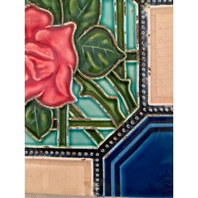 One lot of 4 Art Nouveau tiles in Majolica style. Beautiful jewel tones with floral motifs.