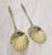 A fine pair of Victorian sterling silver and gilt serving spoons dating to 1887, beautifully designed for serving berries,...