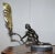 Lovely original Art Deco table lamp with marble base, bronze statue and gold gilt bronze shell shade A good looking well...