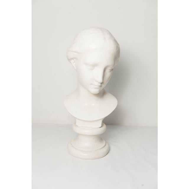 White marble bust of a woman, signed Louvre Museum 1445, in very good condition. Height 43 cm.