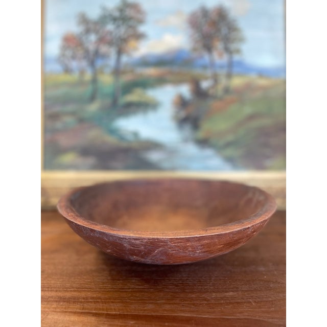 A substantial vintage wooden dough bowl by Munising, dating to the mid-20th century. Likely Hand-turned in Michigan, this...