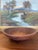 A substantial vintage wooden dough bowl by Munising, dating to the mid-20th century. Likely Hand-turned in Michigan, this...