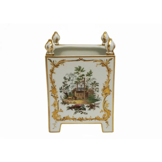 Exquisite late 19th Century square porcelain cachepot raised on four legs and topped with finials at each corner. Each...