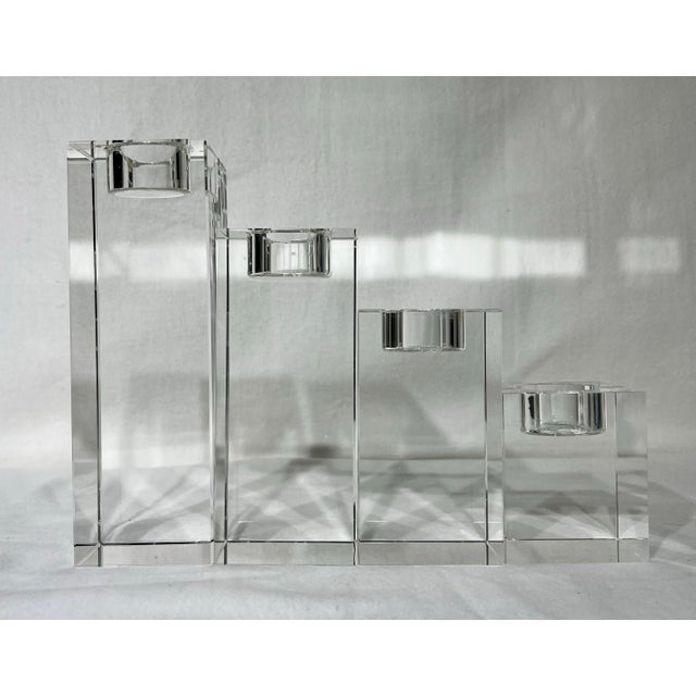 Set of 4 crystal tea light candle holder from the Bombay Company ranging from 3” to 7.5” in height. All in good shape and...