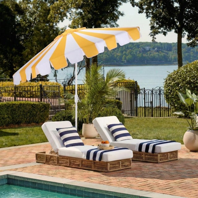 Transform your outdoor space with the vibrant MEZE 9 ft crank umbrella in yellow stripe. This eye-catching shade solution...