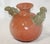 This is a fun, unique piece! Made from red clay, it has been fired at a high temperature and has a nice, even glaze. No...