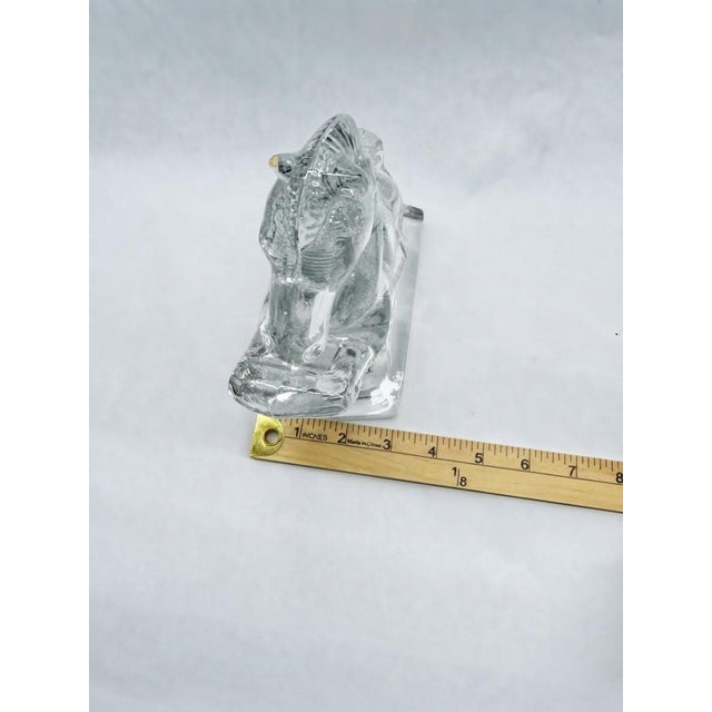 A striking pair of vintage clear glass bookends featuring majestic rearing horses caught mid-gallop on sturdy rectangular...