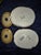 Two hand-painted Italian majolica style ceramic canisters resting on a dark blue fabric surface. Visual Details Form &...
