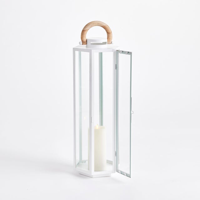 Nautical in style, this handsome outdoor lantern shines brilliantly in a chrome finish and real teak wood handle. Add a...