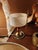 Table lamp with a cylinder shade and round base with detailed red enamel stem on a brass / glass base plastic shade...