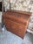 Elegant Danish secretary desk crafted in teak, featuring a roll-top design with a sleek, streamlined silhouette. The piece...