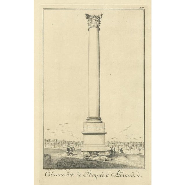 This elegant engraving depicts Pompey’s Column in Alexandria, one of the most celebrated classical monuments of Roman...