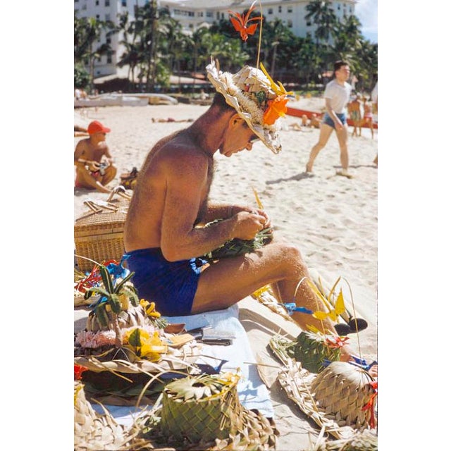 Hawaiian Scenes by Toni Frissell A man weaves sun hats on a Hawaiian beach, 1957. (Photo by Toni Frissell) 16x12" inches /...