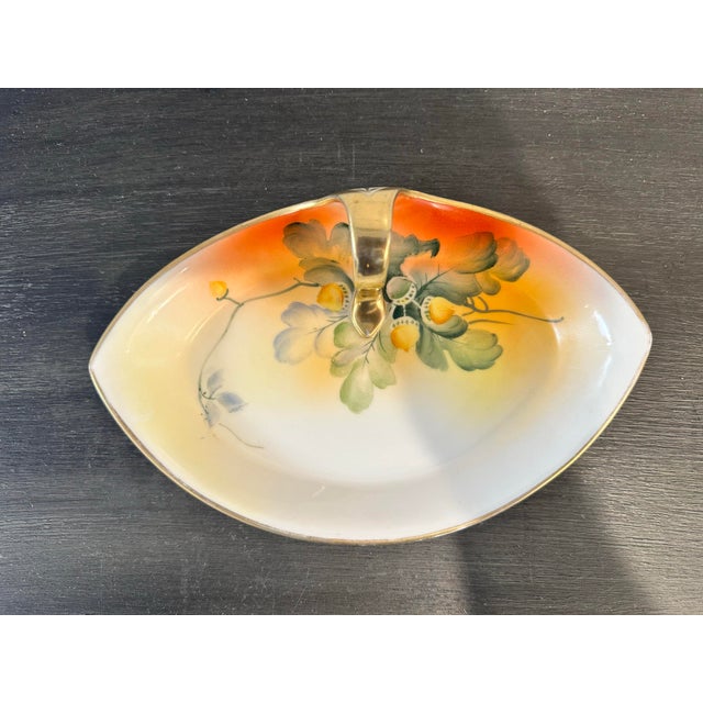 This Uniquely Shaped Style Nippon Vintage Hand Painted Dish with Vibrant Colors measures 8" L x 5" W x 2.25" H and is in...