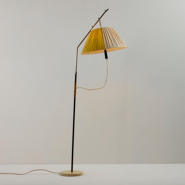 Metal floor lamp in the style of J. T. Kalmar from the 1950s. The floor lamp has a plastic lampshade and its height is...