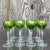 A stunning set of vintage Regency wine glasses. Chic emerald cut crystal in a floating leaf motif. Long faceted stems....