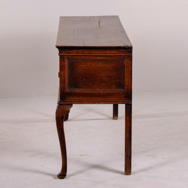 Found in England, this Georgian oak dresser base dates from the 1820s. Originally the base of a highboy dresser or...