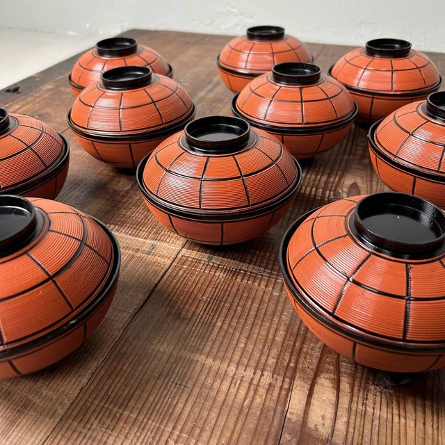 Beautiful set of 10 lacquerware dining bowls from the 1970s, complete with original wooden storage box adorned with...