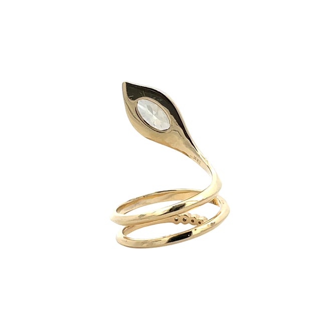 Striking 18K yellow gold snake-inspired swirl ring featuring an eye-shaped GIA-certified oval diamond weighing 1.12 carats...