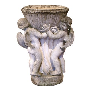 19th Century French Carved Patinated and Weathered Stone Planter With Cherubs For Sale