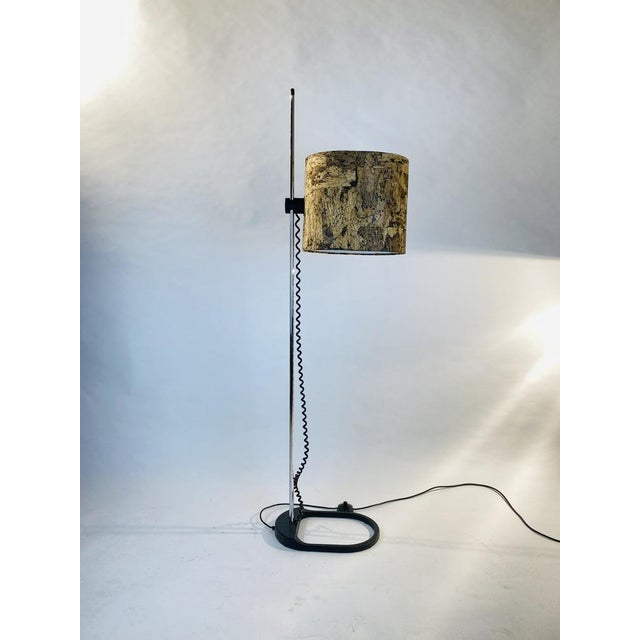 Rare floor lamp by STAFF, Germany from the 1970s. The oval lampshade is covered with expressive cork. The natural material...