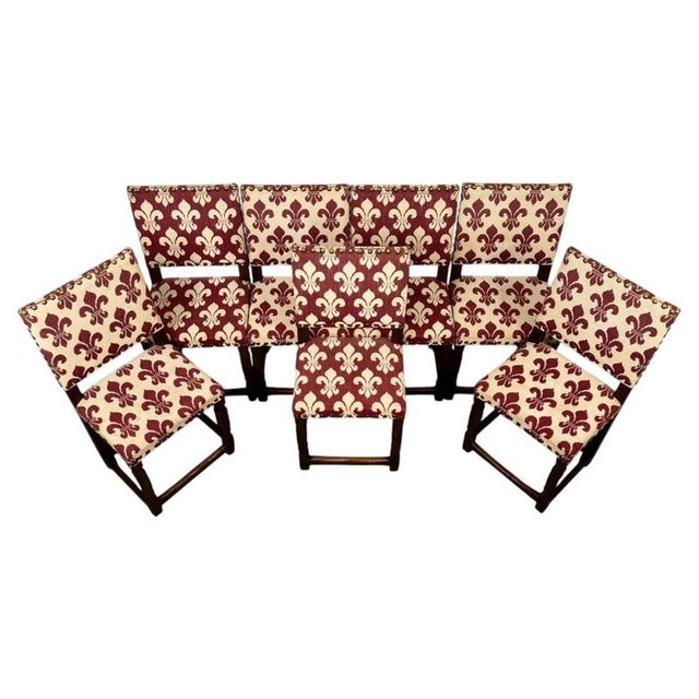 An impressive and unusually large set of fourteen early 20th-century English dining chairs, finely crafted from oak and...