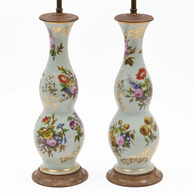 Pair tall antique Louis Philippe French opaline glass table lamps. Decorated with hand Ppainted flowers and gilding on a...