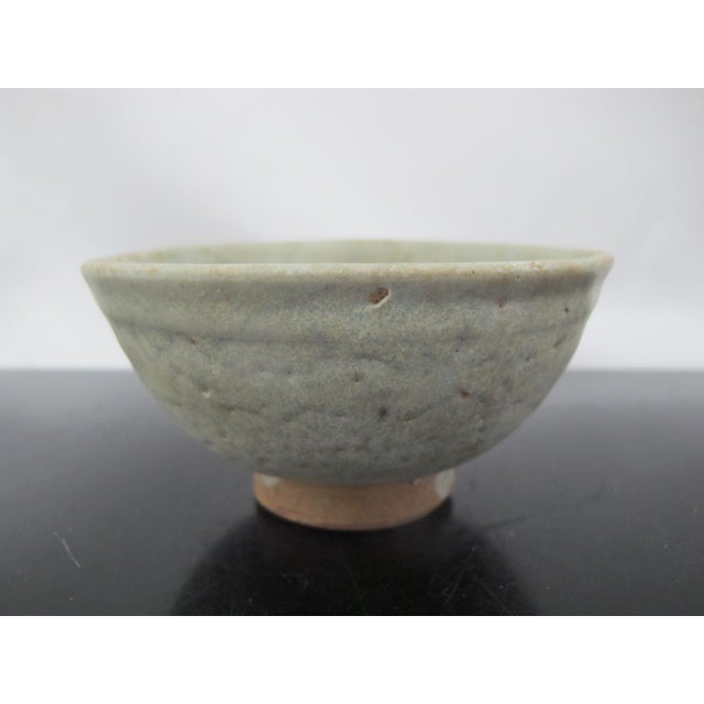 Chinese Southern Song Yuan style celadon glazed bowl. Small footed bowl with thick, pale blue green glaze and rounded...