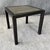 This Charleston Forge metal side table features a sleek black frame and a distinctive textured top with a layered, organic...