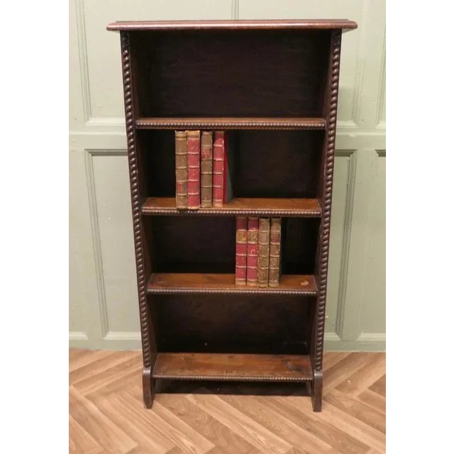 A Good Early 20th Century Open Oak Bookcase This is an attractive piece, the book case has 4 shelves and has a carved...