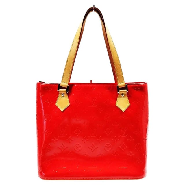 This classic Louis Vuitton Houston tote bag is crafted from striking red Monogram Vernis patent leather, beautifully...