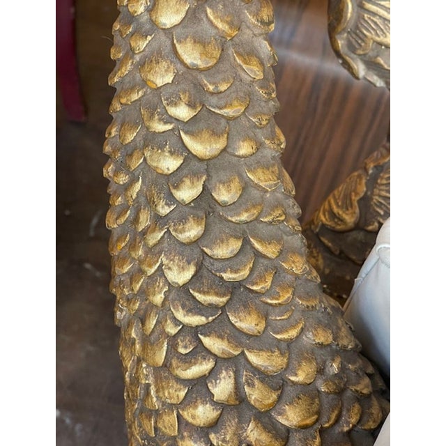 The Vintage Italian Carved and Giltwood Grotto Chair is a luxurious and unique piece of furniture. This chair features...