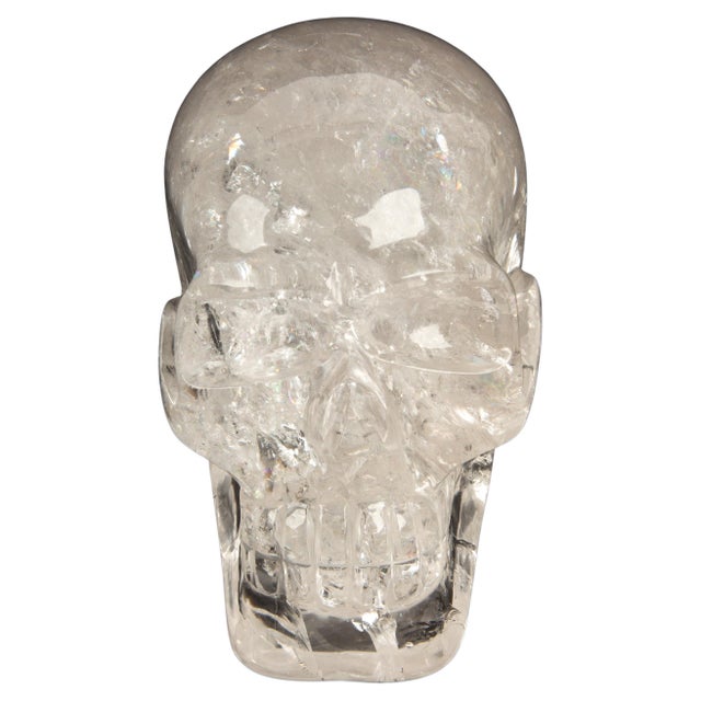 This strikingly carved large rock crystal skull is a mesmerizing fusion of artistry and nature. Measuring approximately...
