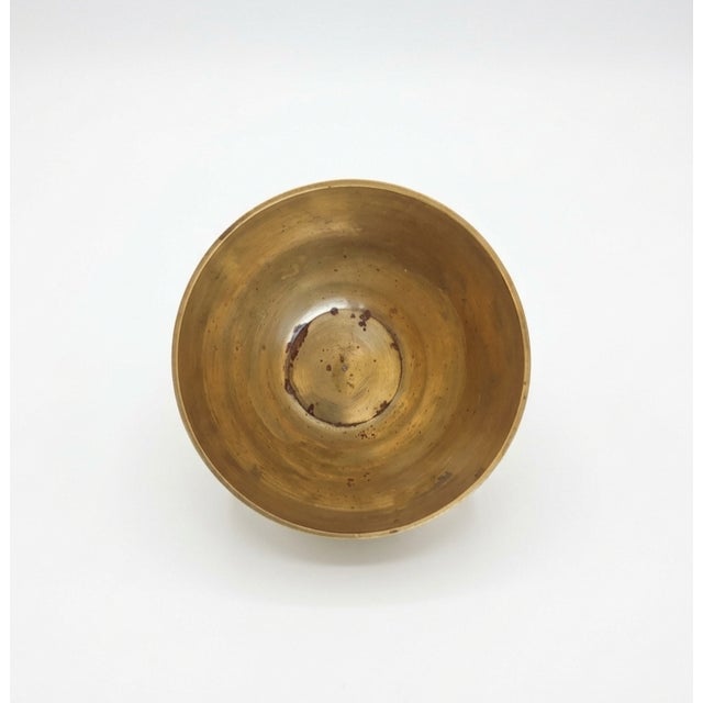 Add a touch of curated, globetrotter character to your shelving or entryway with this beautiful vintage solid brass bowl....