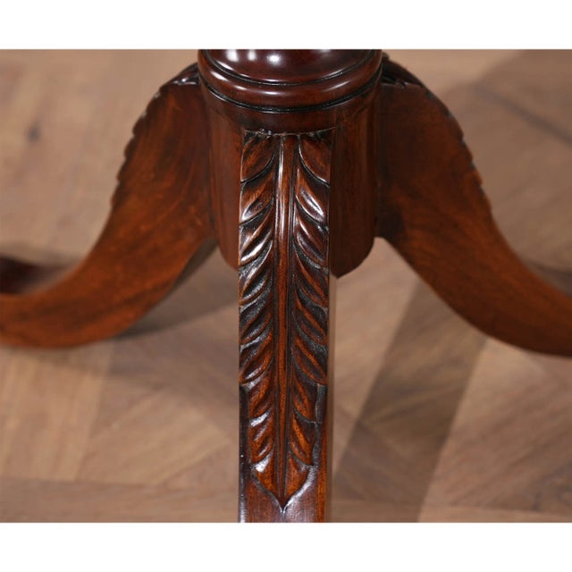 A Mahogany Coat Tree in Sheraton style produced by Niagara Furniture. Features include solid mahogany construction with...